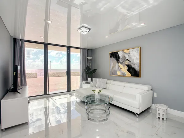 a living room with furniture and a large window