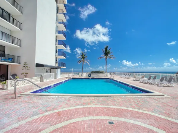 a view of a living room with kitchen