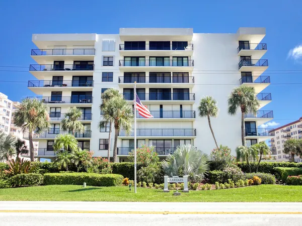 a view of kitchen with furniture and refrigerator