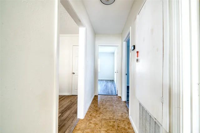 a view of a bedroom from a hallway