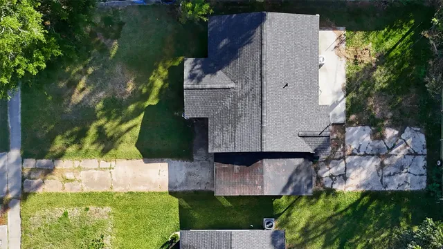 an aerial view of a house with a garden