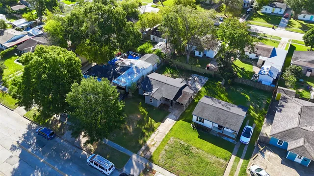 an aerial view of house with yard