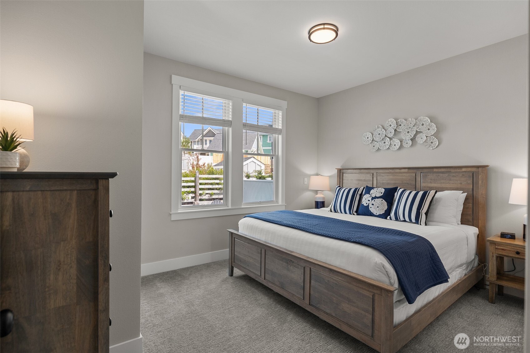 37 Elk Creek Road Raymond, WA 98577 - Photo 17 of 26 a bed sitting in a bedroom next to a window