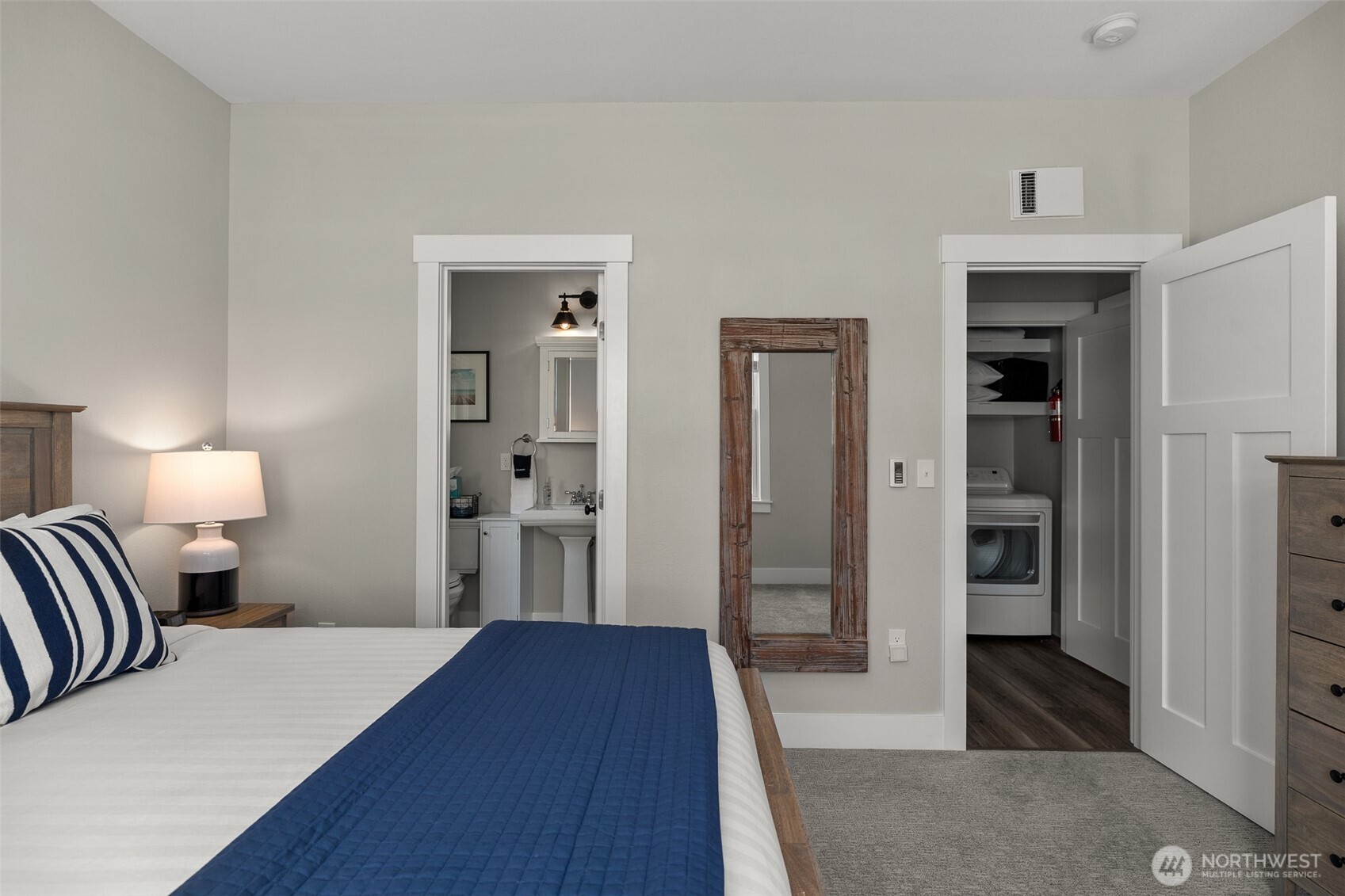 37 Elk Creek Road Raymond, WA 98577 - Photo 18 of 26 a bedroom with a bed and a walk in closet