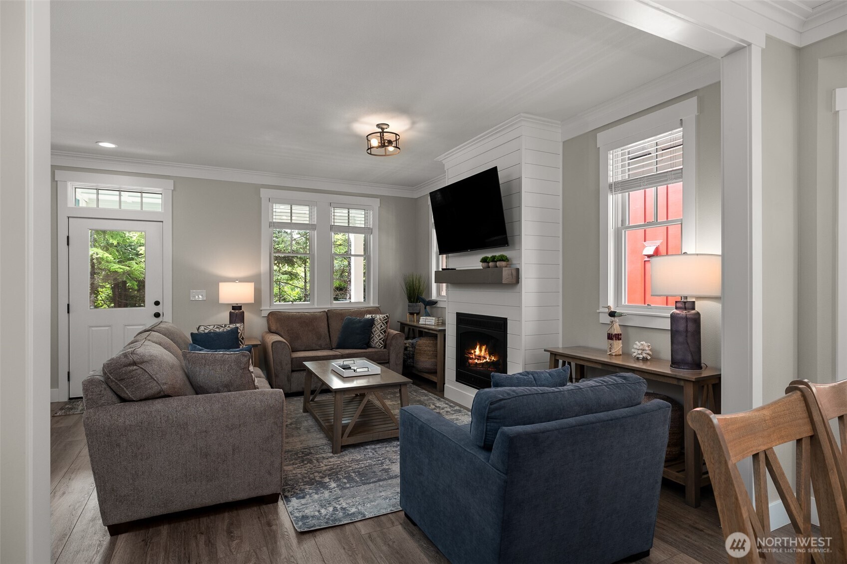 37 Elk Creek Road Raymond, WA 98577 - Photo 8 of 26 a living room with furniture a flat screen tv and a fireplace