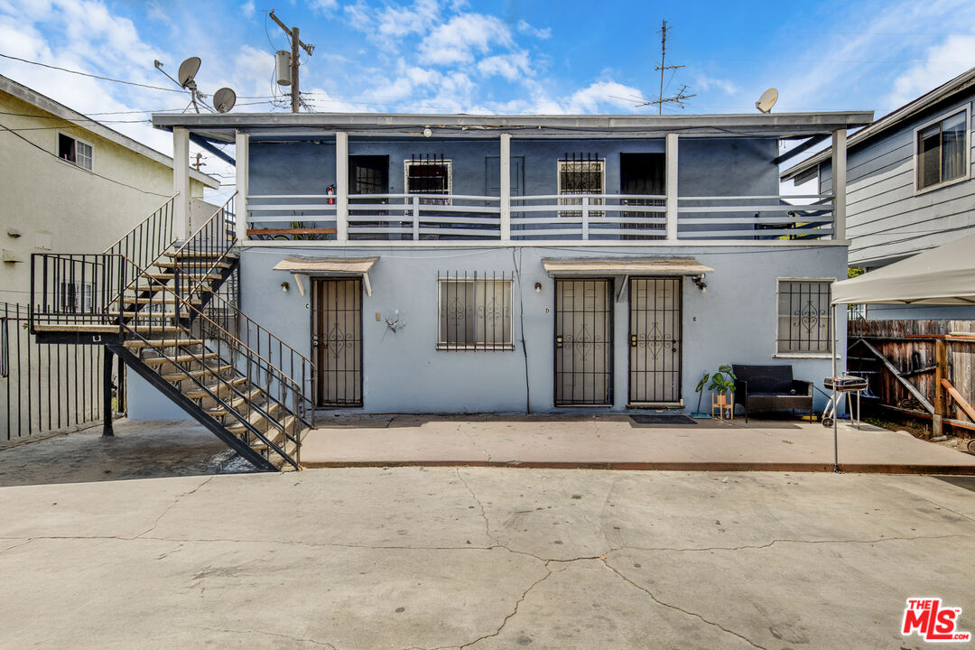 1081 Cherry Avenue Long Beach, CA 90813 - Photo 4 of 9 a front view of a house with garage