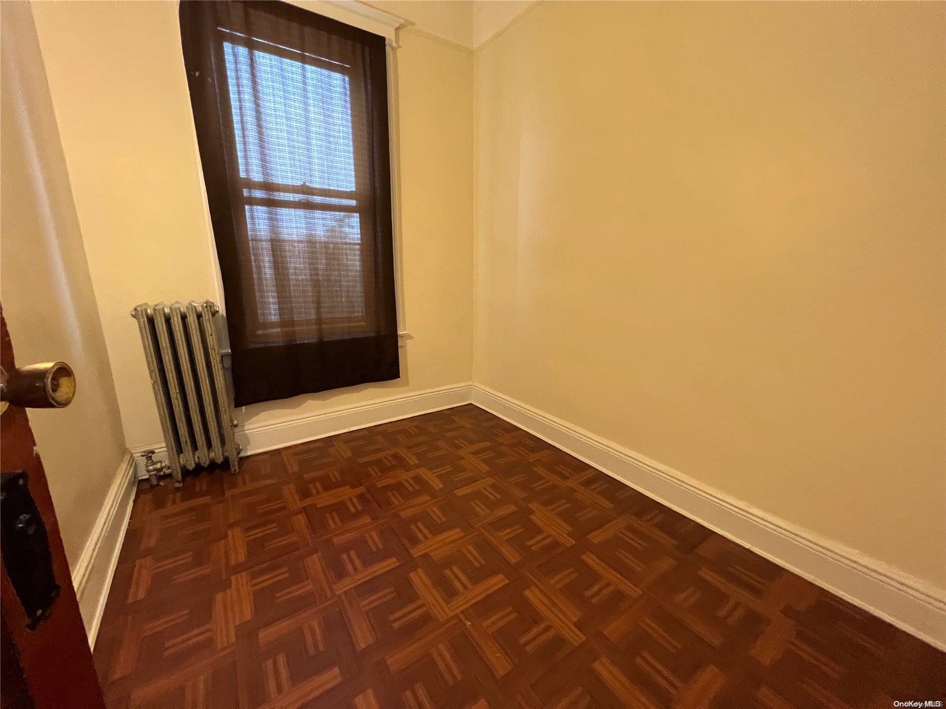 368 Eldert Lane Brooklyn, NY 11208 - Photo 7 of 10 an empty room with windows