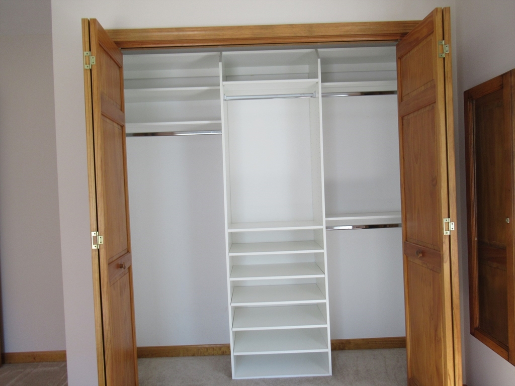 25 Rodeo Drive East Bridgewater, MA 02333 - Photo 12 of 17 a view of walk in closet with empty racks
