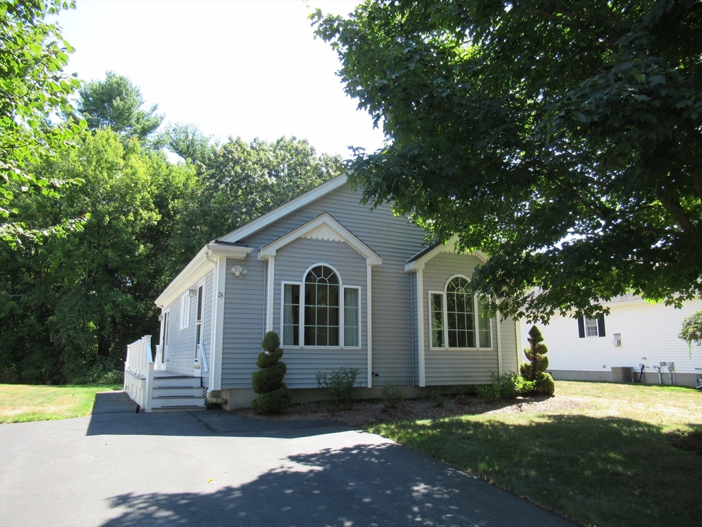 25 Rodeo Drive East Bridgewater, MA 02333 - Photo 2 of 17 a view of a yard in front of a house with large tree