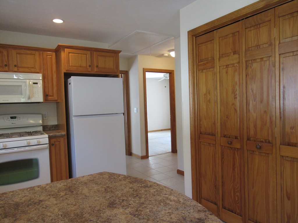 25 Rodeo Drive East Bridgewater, MA 02333 - Photo 5 of 17 a kitchen with a refrigerator and a stove