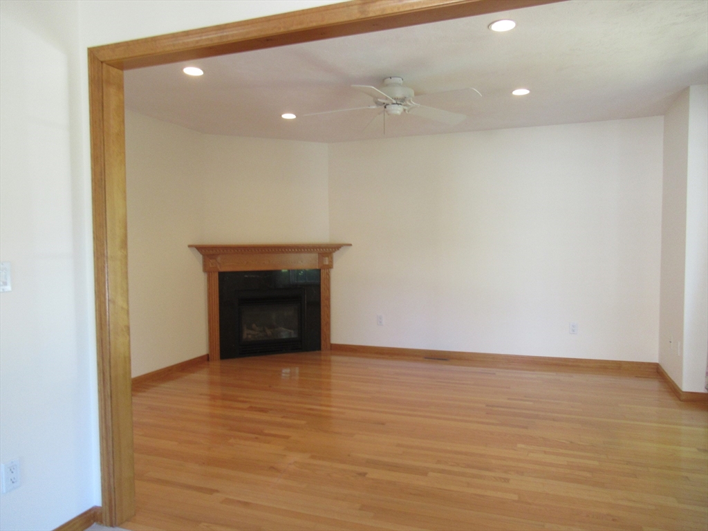 25 Rodeo Drive East Bridgewater, MA 02333 - Photo 6 of 17 a view of an empty room with wooden floor and a window