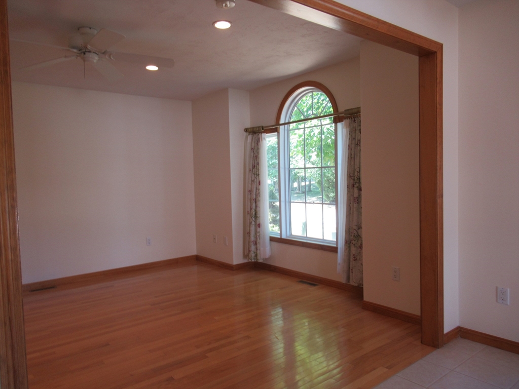 25 Rodeo Drive East Bridgewater, MA 02333 - Photo 7 of 17 wooden floor in an empty room with a window