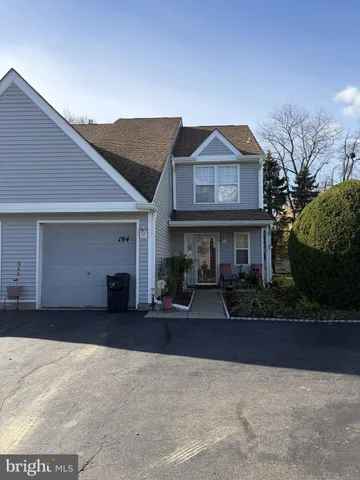 a view of a house with sitting area and garden