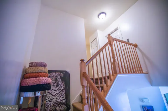 a view of entryway with furniture and wooden floor