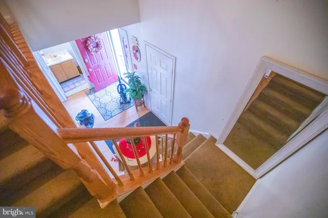 a bathroom with a sink a toilet and shower curtain