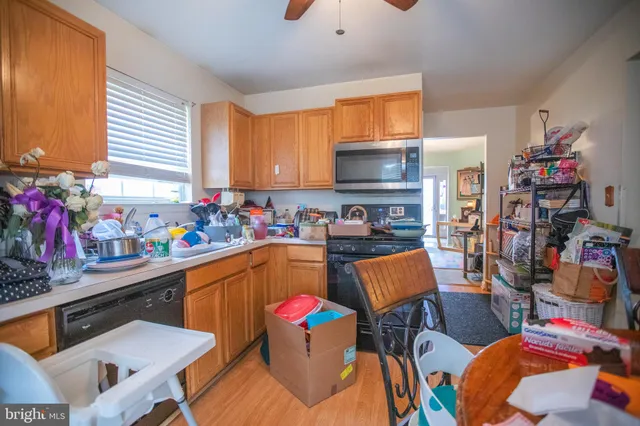 a living room with furniture fireplace and a window