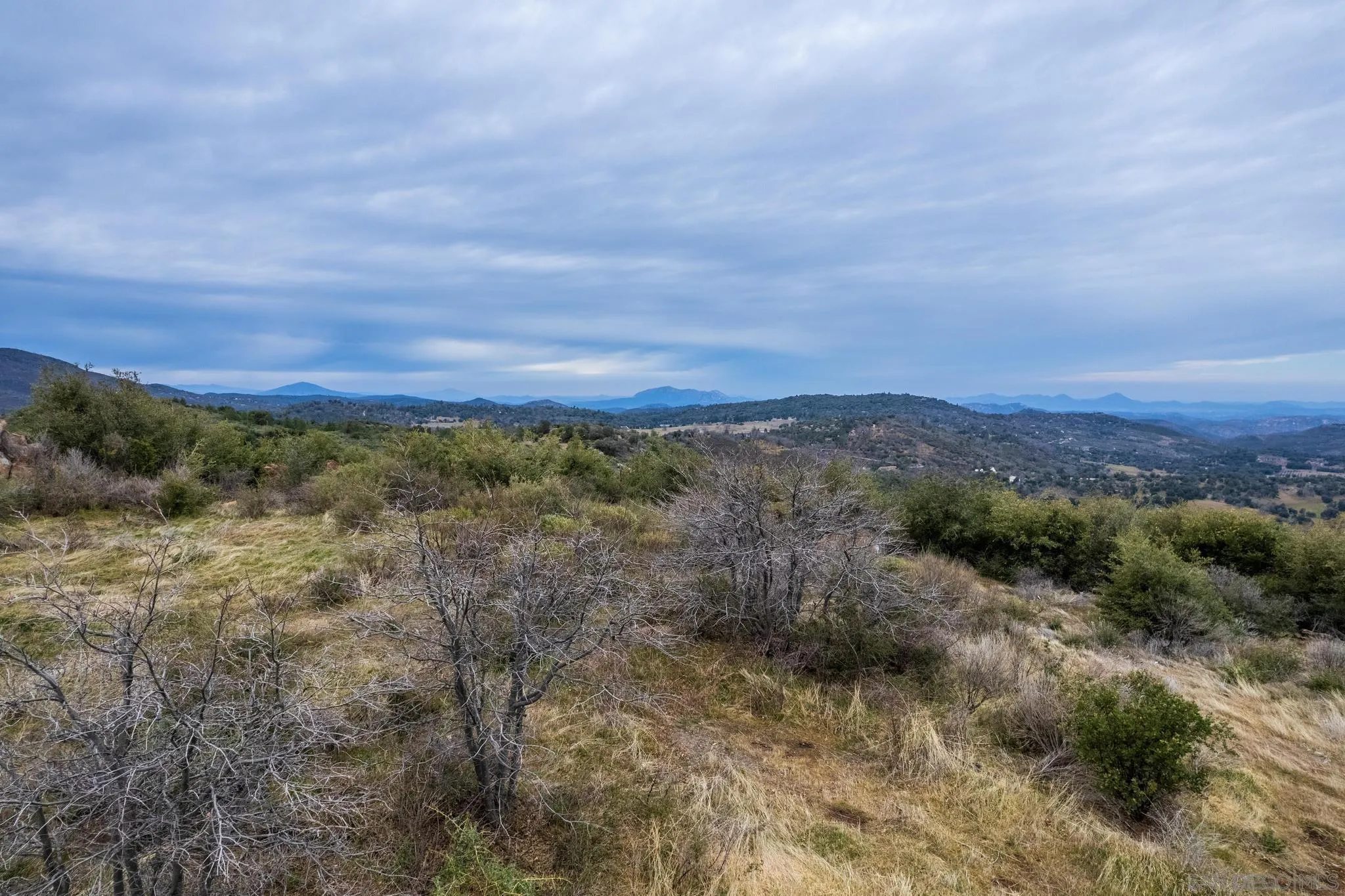 0 Slumbering Oaks Trail, Unit A Julian, CA 92036 - Photo 9 of 20 a view of a dry yard with mountains and green space