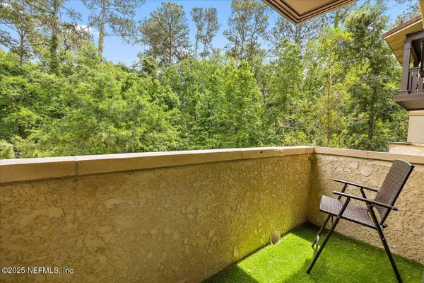 a view of a balcony with chairs