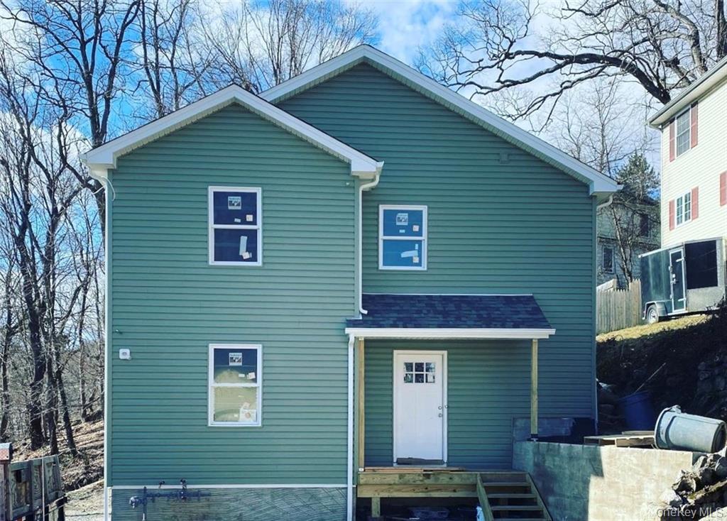 a front view of a house with garage