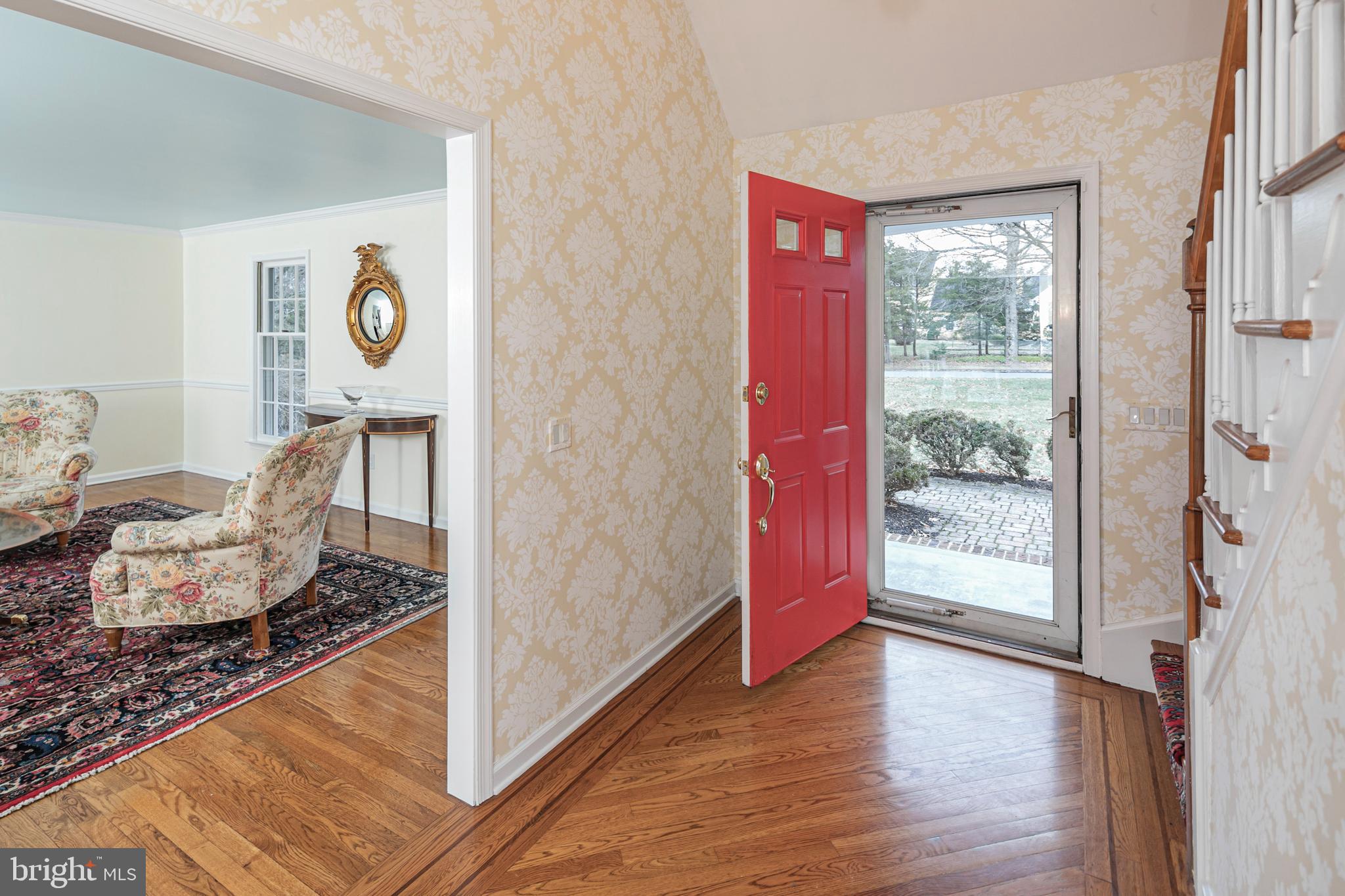 23 Meadow Lane Pennington, NJ 08534 - Photo 4 of 60 a very nice looking room with wooden floor and a rug