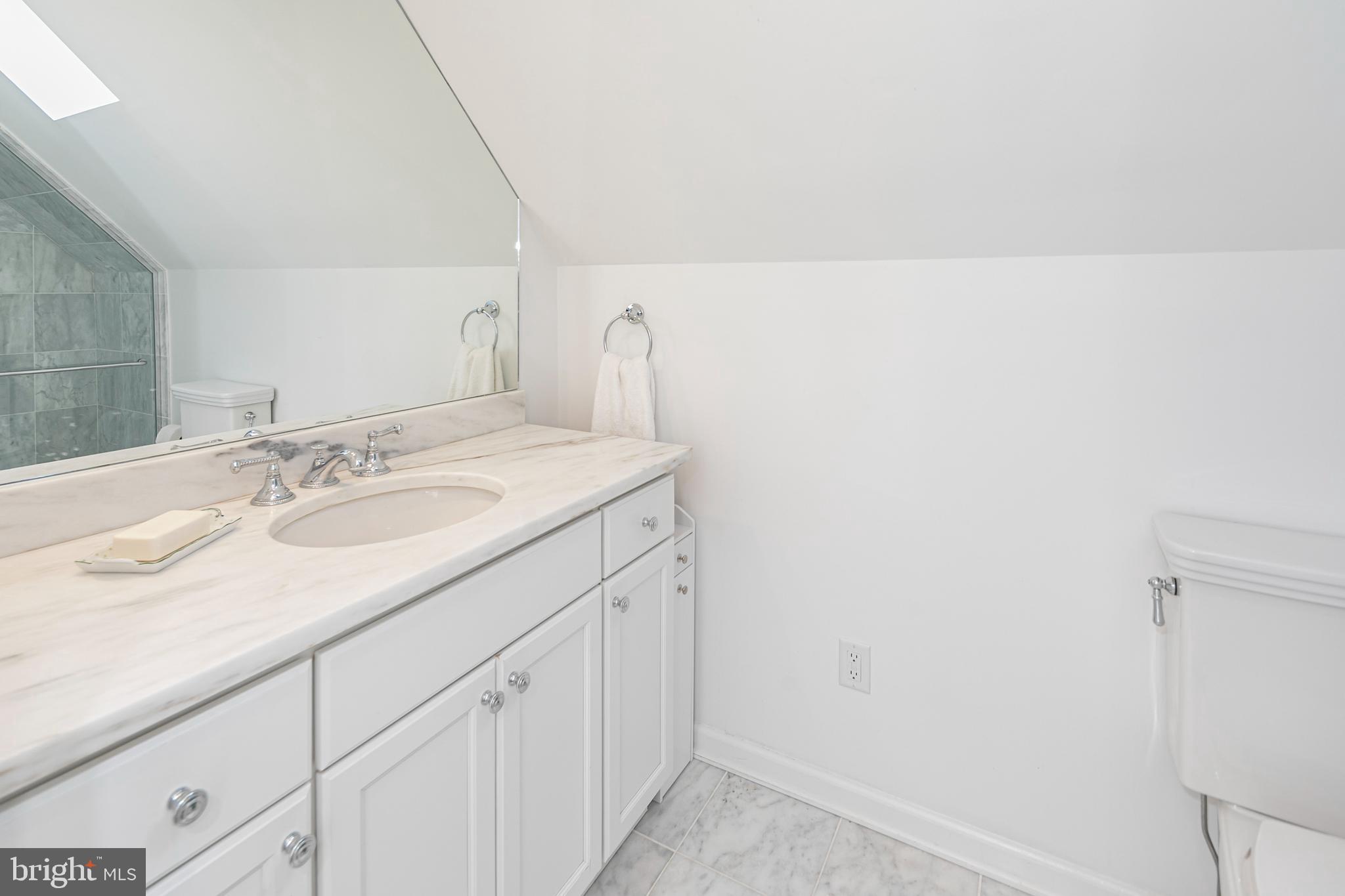 23 Meadow Lane Pennington, NJ 08534 - Photo 44 of 60 a bathroom with a sink and a mirror