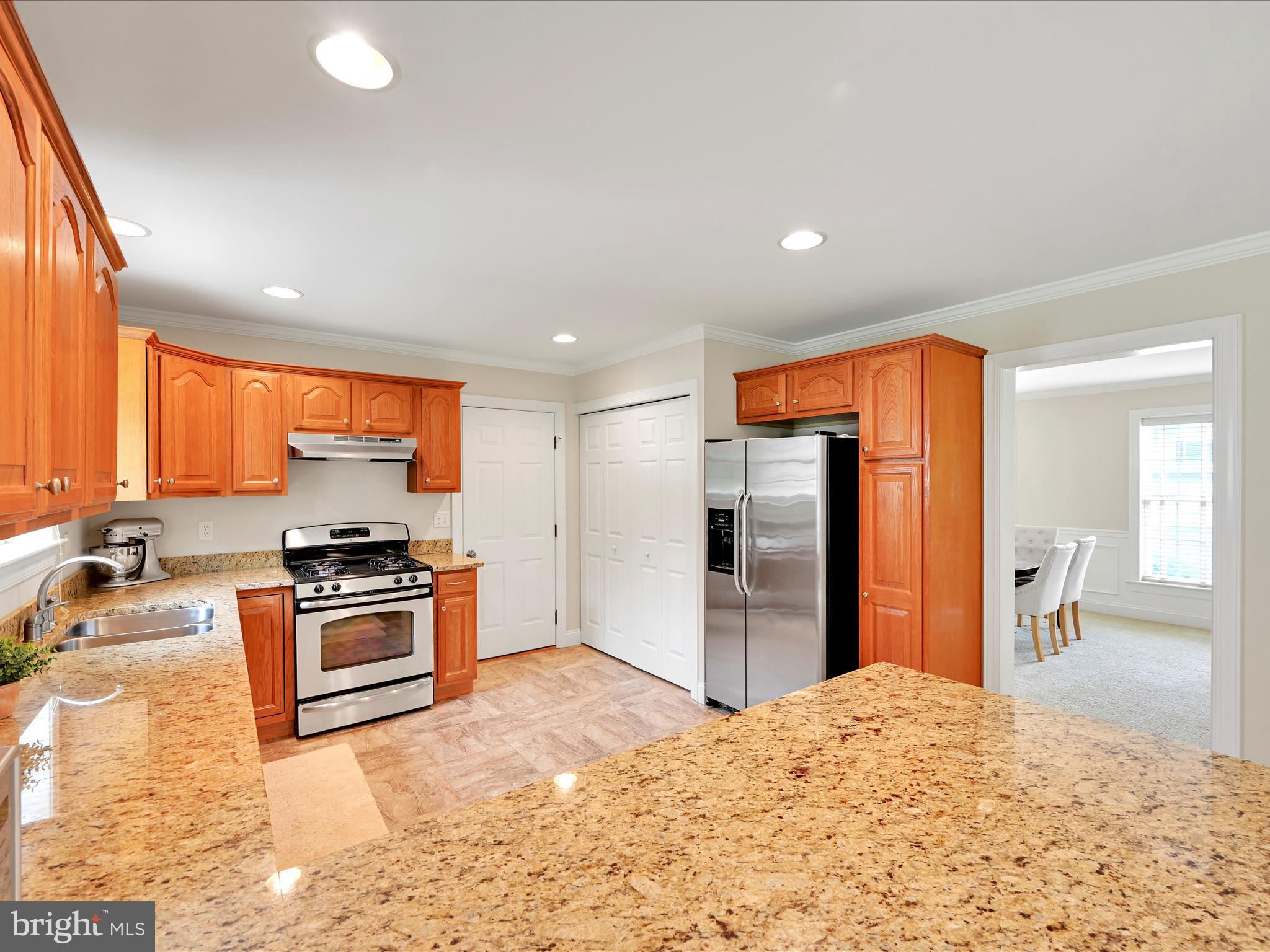 7 West Ridge Road Lititz, PA 17543 - Photo 11 of 40 a kitchen with stainless steel appliances granite countertop a stove a refrigerator and a sink