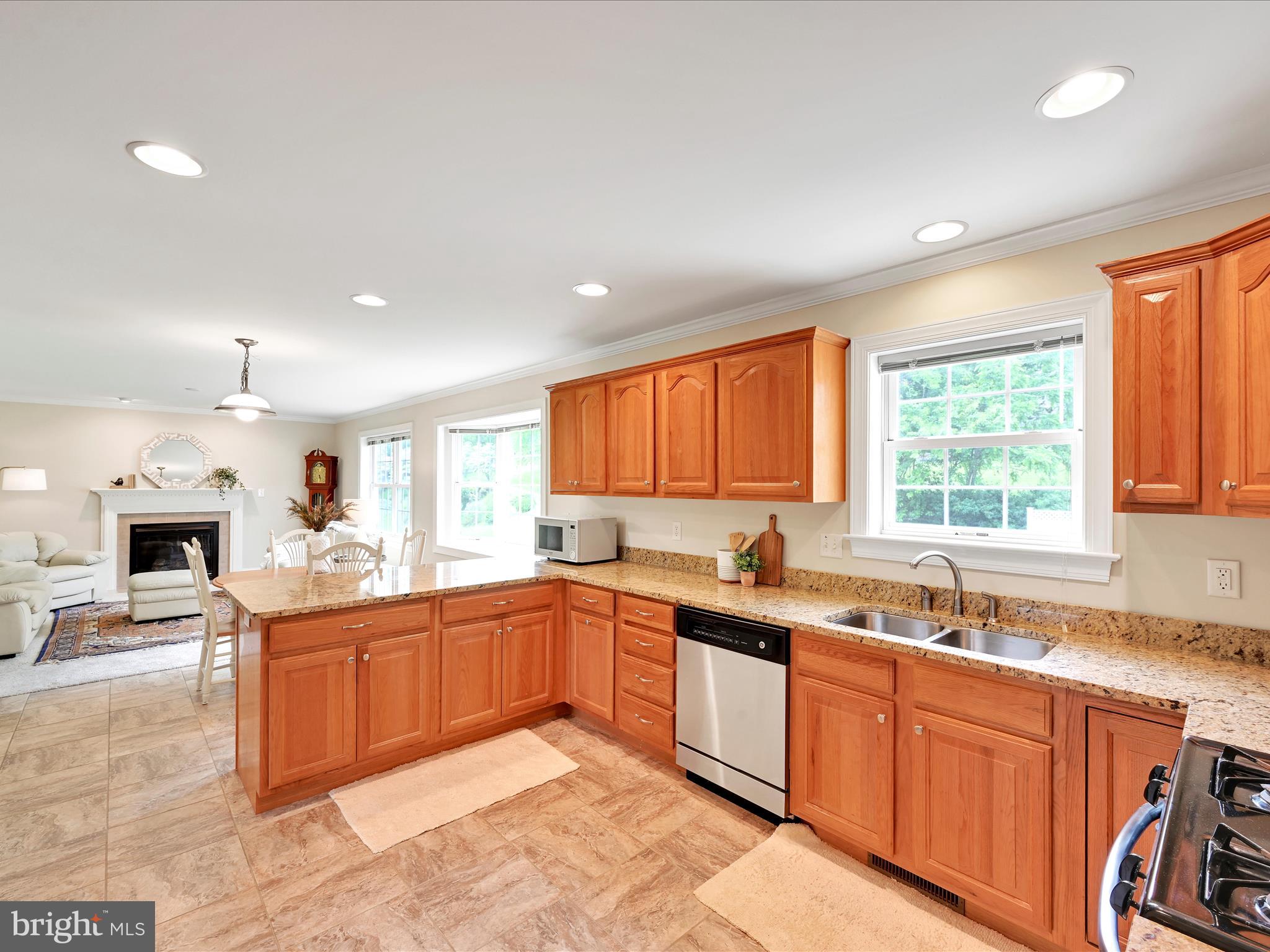 7 West Ridge Road Lititz, PA 17543 - Photo 12 of 40 a kitchen with granite countertop a sink dishwasher stove and cabinets