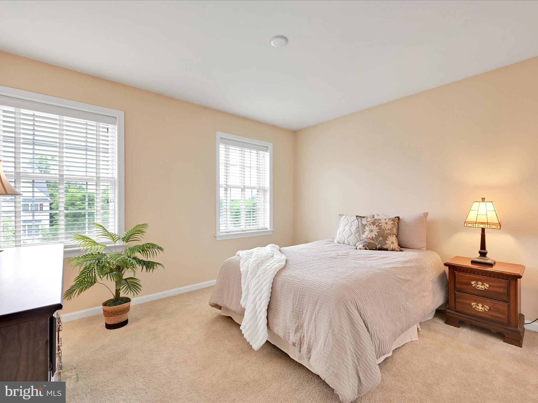 7 West Ridge Road Lititz, PA 17543 - Photo 23 of 40 a bedroom with a bed a chandelier and a window