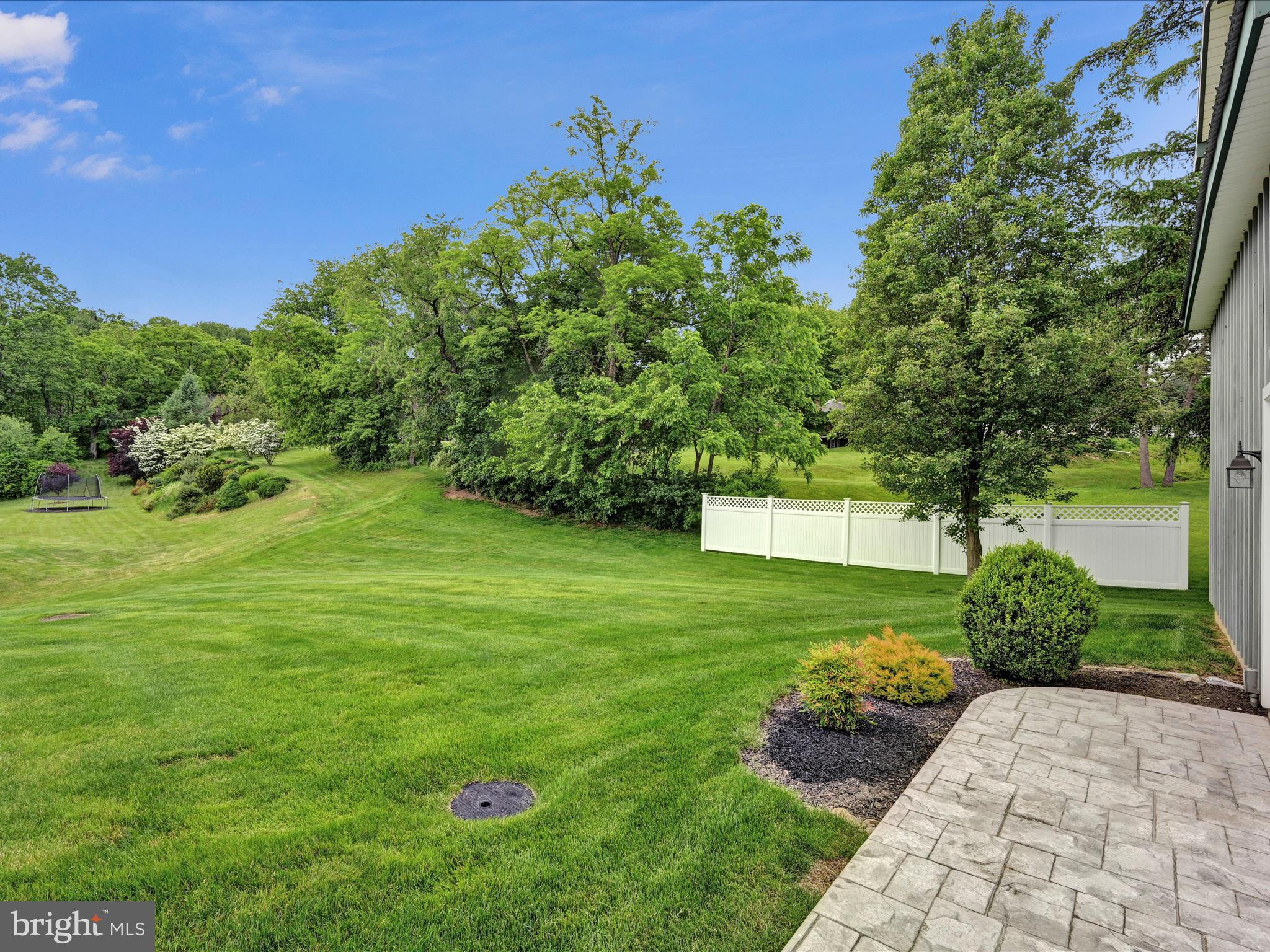 7 West Ridge Road Lititz, PA 17543 - Photo 32 of 40 a view of a garden with a bench in the background