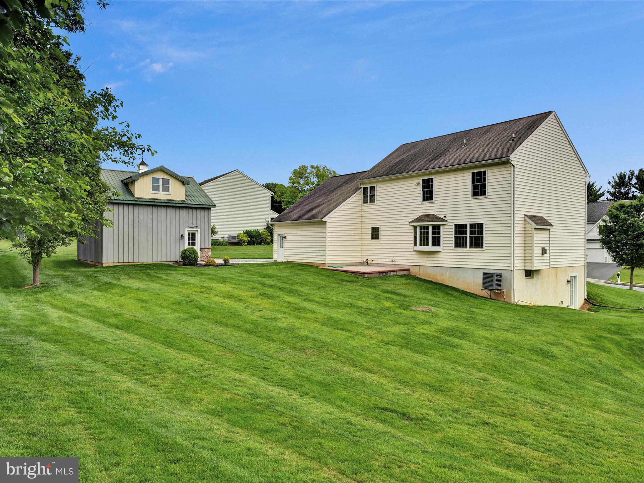 7 West Ridge Road Lititz, PA 17543 - Photo 39 of 40 a view of a white house with a big yard and large trees