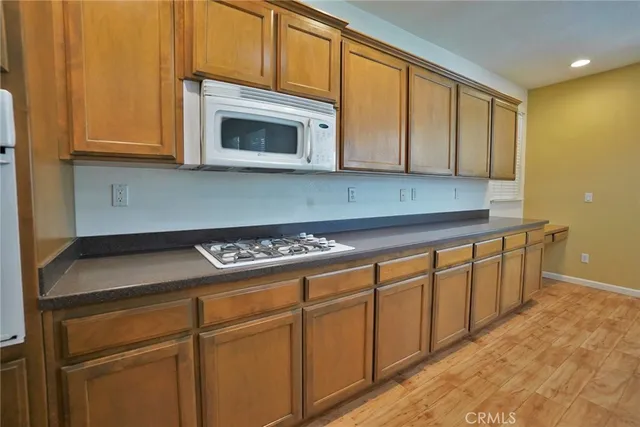 a view of an empty room and fire place
