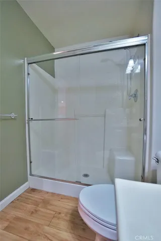 a bathroom with a shower and a bath tub