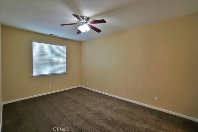 a spacious bathroom with a granite countertop sink and a mirror
