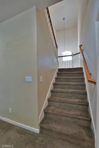 an empty room with closet and a ceiling fan