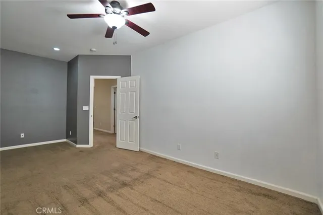 a view of a house with swimming pool and sitting area