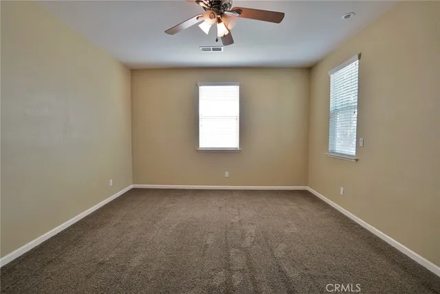 a kitchen with stainless steel appliances granite countertop a stove and a shower