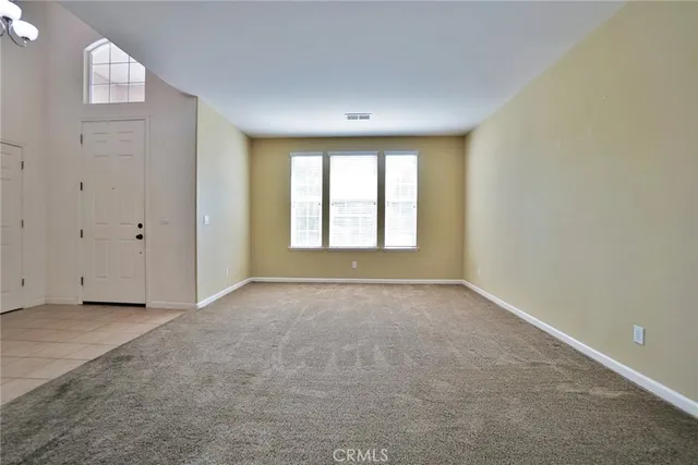 a view of a hallway with windows