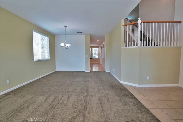 a large kitchen with stainless steel appliances kitchen island granite countertop a large counter top and wooden floors