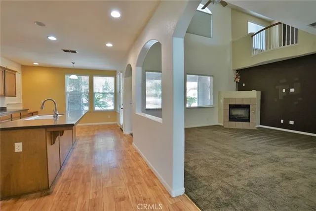 a kitchen with stainless steel appliances granite countertop a stove a microwave and cabinets