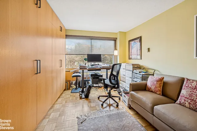 a work room with furniture and a window