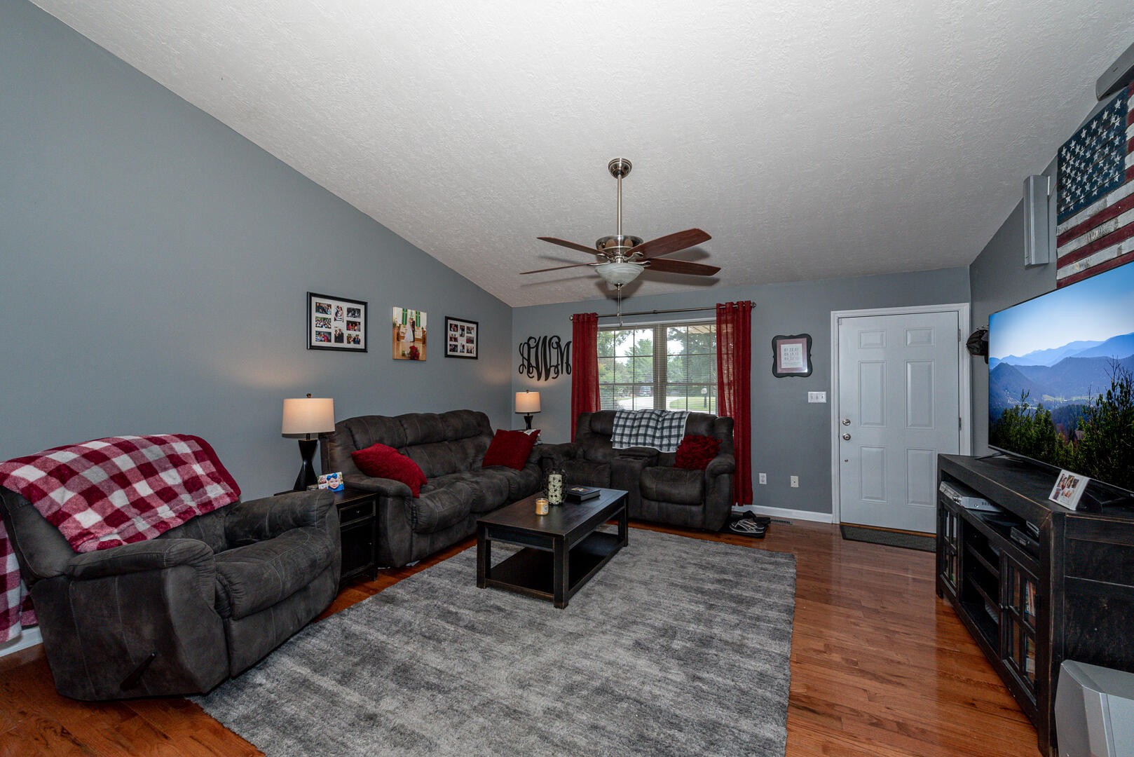 4204 Crestfield Road Knoxville, TN 37921 - Photo 7 of 23 a living room with furniture and a flat screen tv