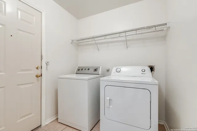a utility room with dryer and washer