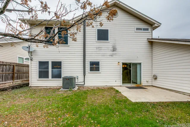 a view of a house with a yard and garage