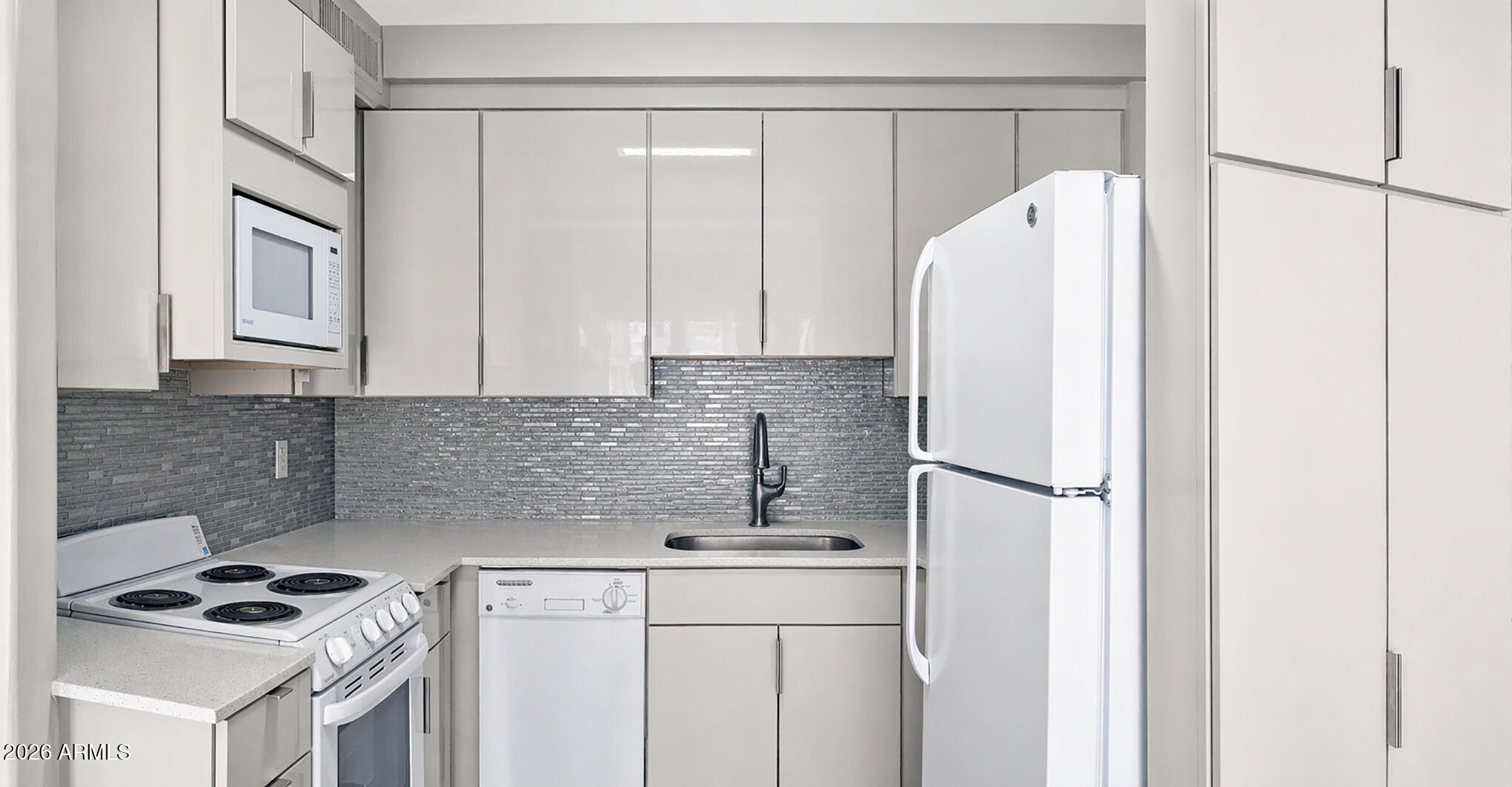 1018 East Osborn Road, Unit A Phoenix, AZ 85014 - Photo 3 of 19 a kitchen with a refrigerator and a sink