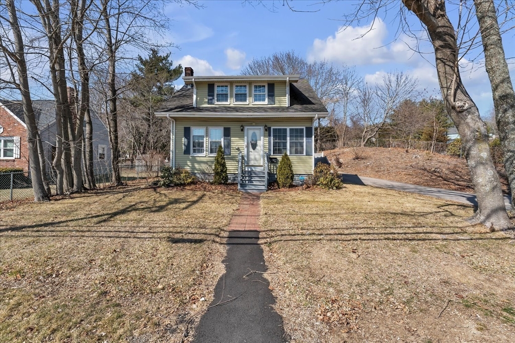 a front view of a house with yard