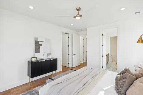 a bedroom with a bed and cabinets