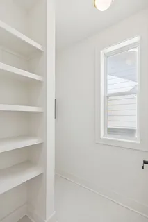 a view of a room that has a window in it