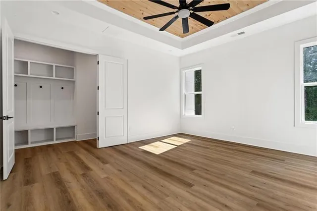 a white bath tub sitting next to a bathroom sink