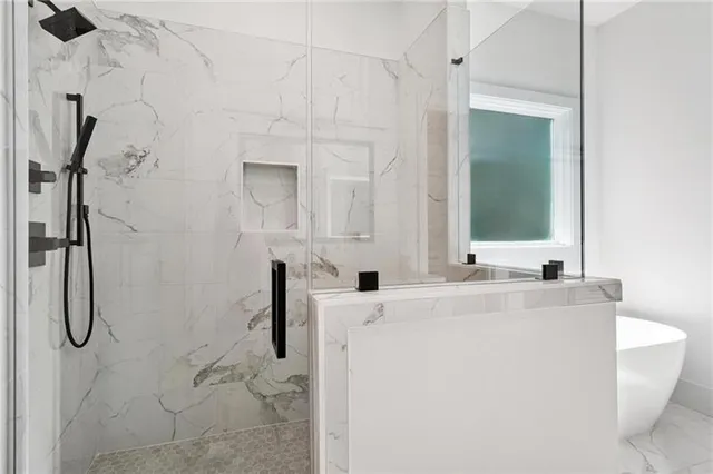 a bathroom with a double vanity sink mirror and