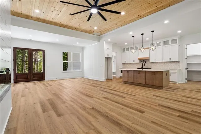 a view of kitchen with cabinets and wooden floor